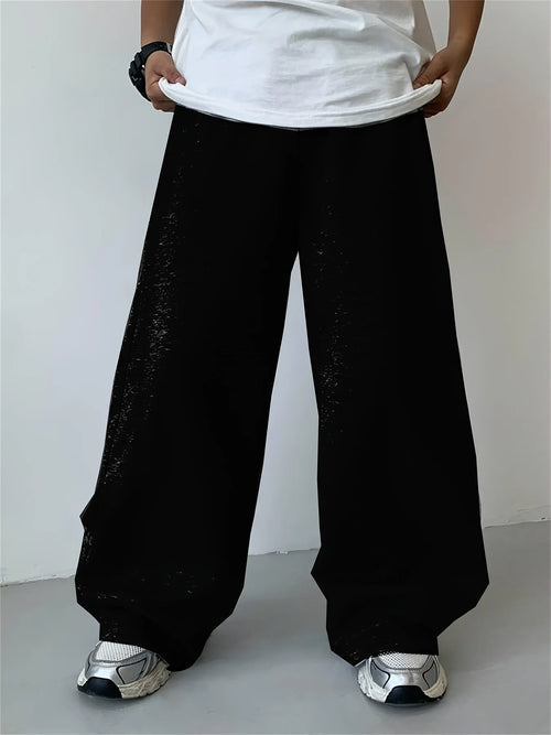 Loose, straight-leg gray trousers. Soft, everyday pants. Unisex
