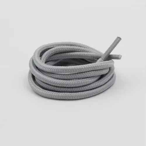 Light gray shoelace flat circular basketball sports running shoe board