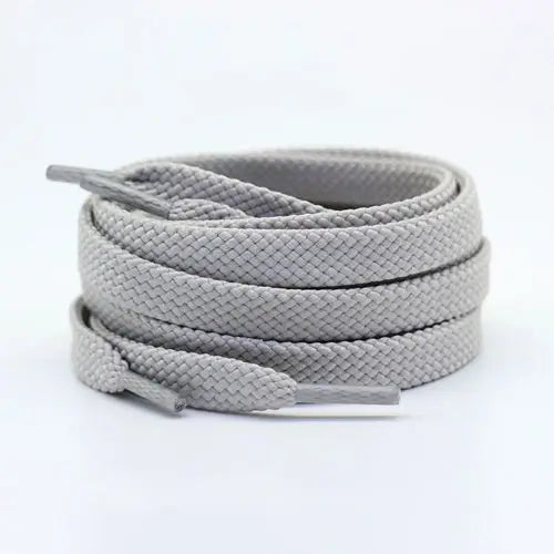 Light gray shoelace flat circular basketball sports running shoe board