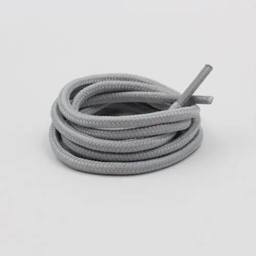 Light gray shoelace flat circular basketball sports running shoe board