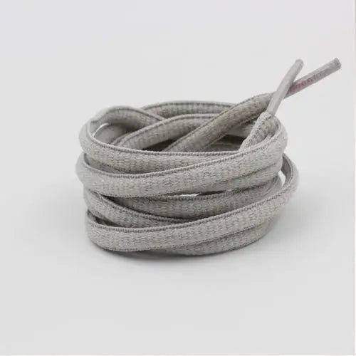 Light gray shoelace flat circular basketball sports running shoe board