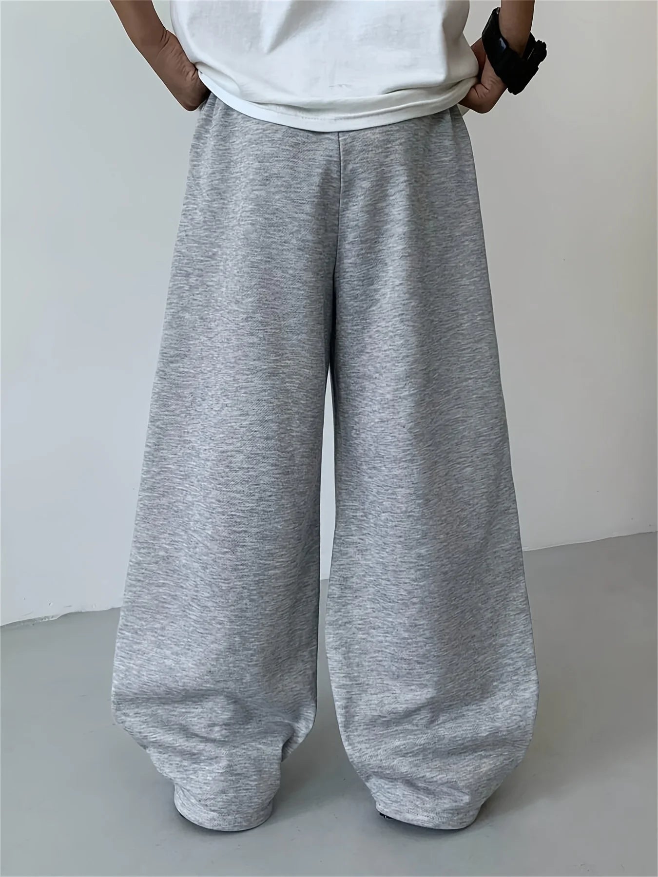 Loose, straight-leg gray trousers. Soft, everyday pants. Unisex