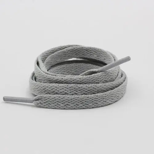 Light gray shoelace flat circular basketball sports running shoe board