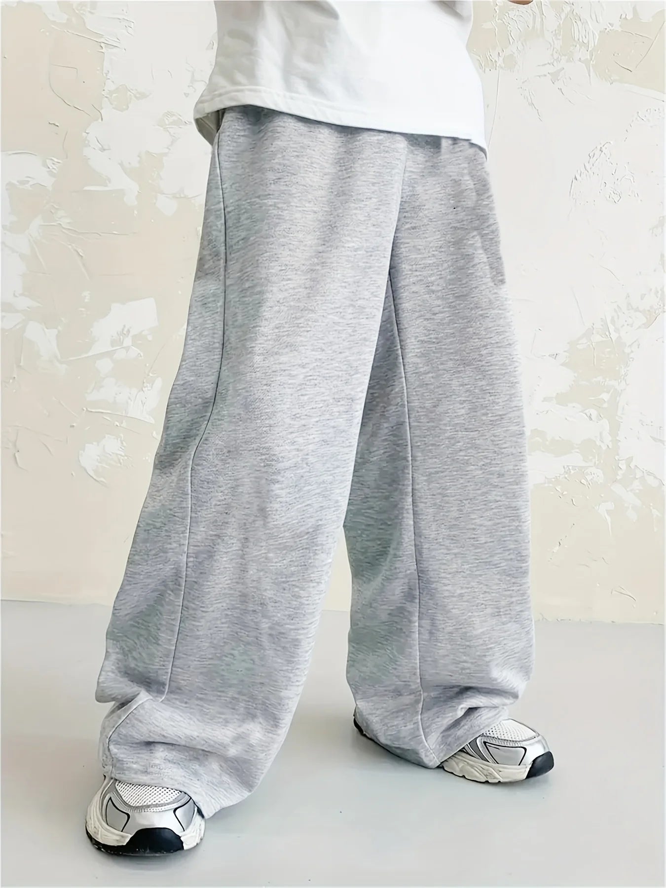 Loose, straight-leg gray trousers. Soft, everyday pants. Unisex