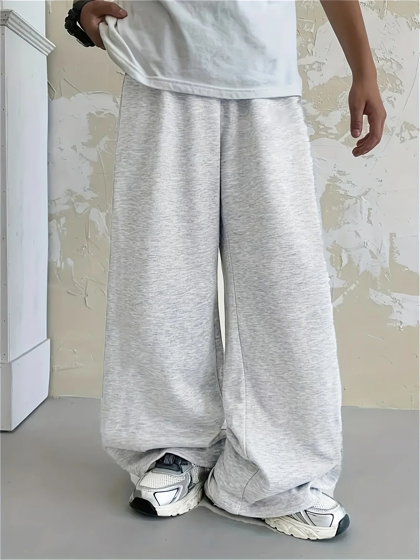 Loose, straight-leg gray trousers. Soft, everyday pants. Unisex