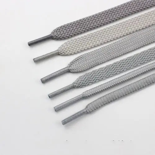 Light gray shoelace flat circular basketball sports running shoe board