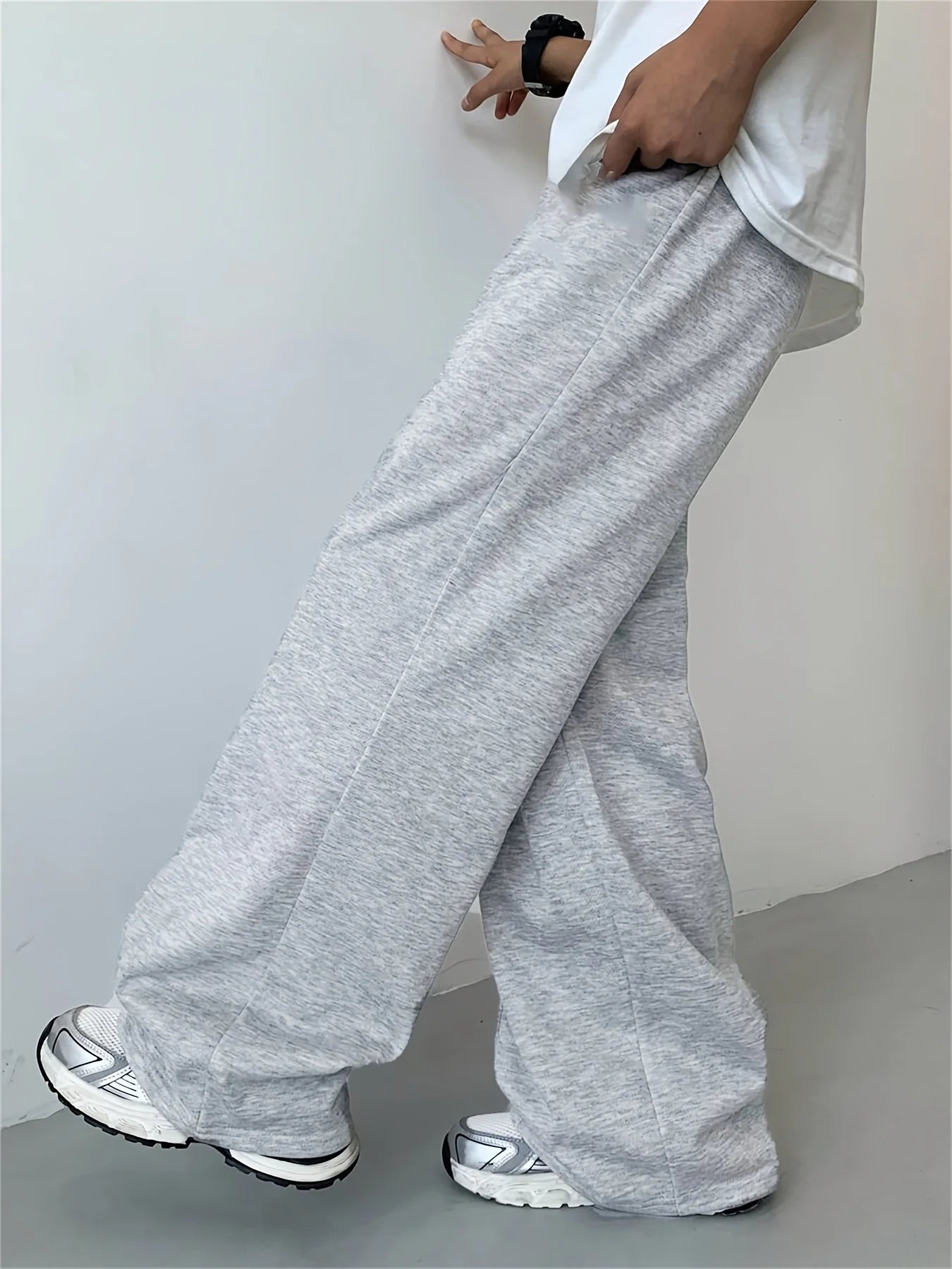 Loose, straight-leg gray trousers. Soft, everyday pants. Unisex