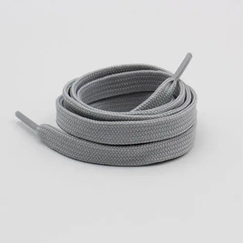 Light gray shoelace flat circular basketball sports running shoe board